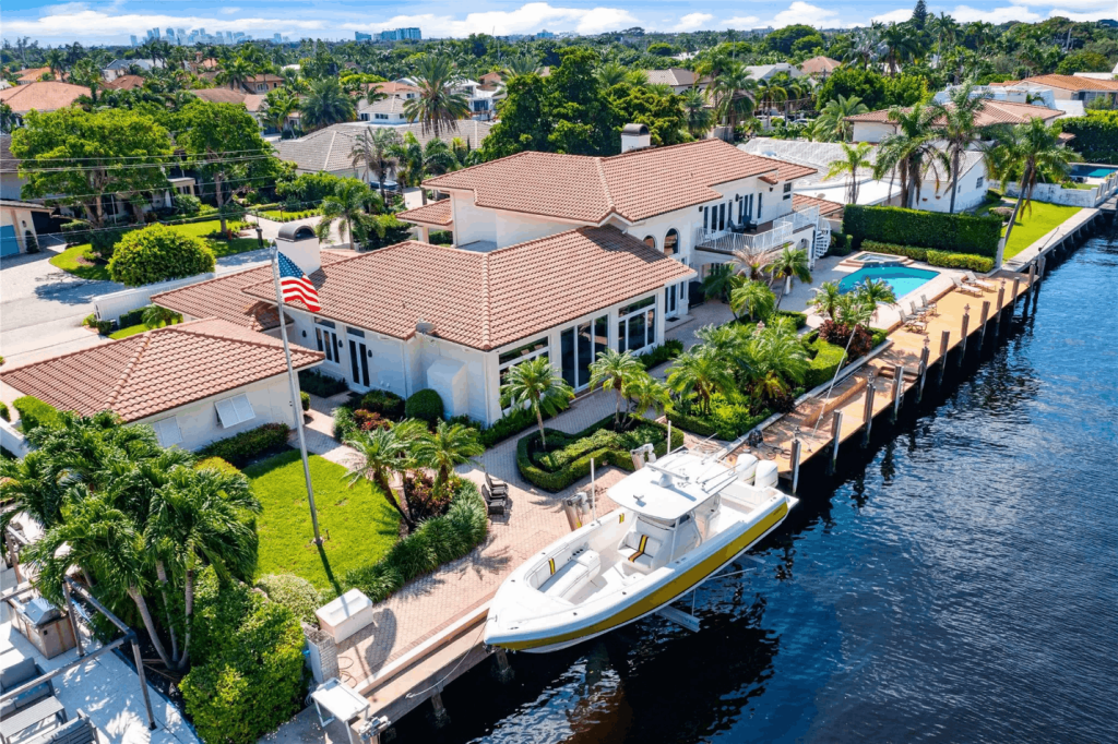Waterfront home in Coral Ridge with private dock, boat access, and deep-water canal frontage.