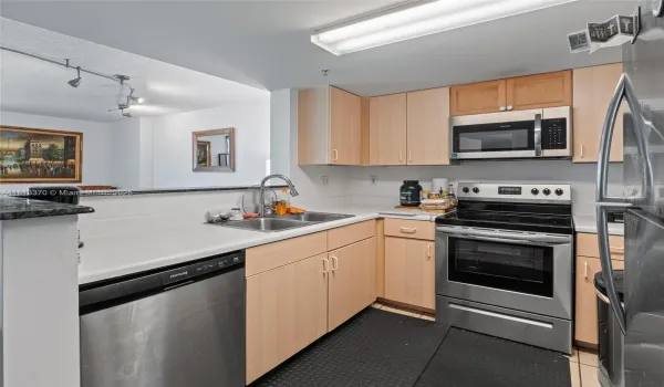 KITCHEN WITH NEWER STAINLESS STEEL APPLIANCES