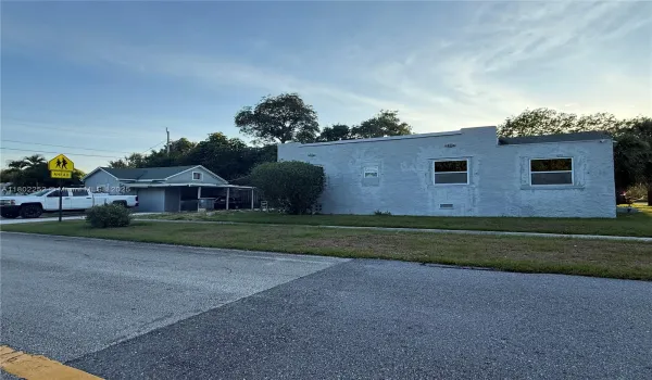 This is a picture of the full property including the main house and the guest house you can also view the carport