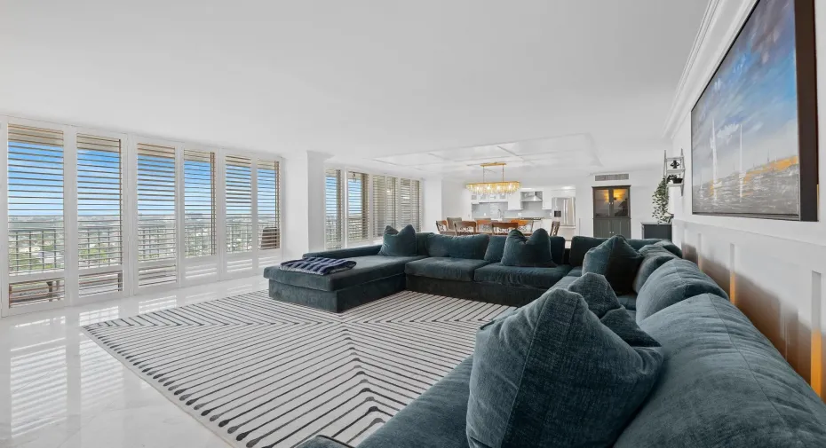 Huge living and dining area with floor to ceiling glass