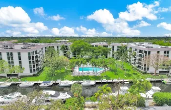 Serene location overlooking gardens, pool and canal.