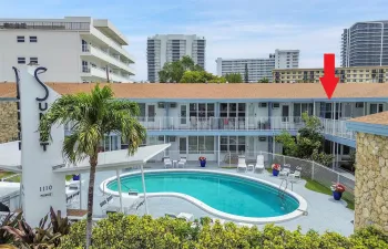 This Second Floor Poolside Retreat Boasts Impact Windows & Doors, Retractable Screen Door, Three Friedrich A/C units (One with Heat, 2023 & 2024), 2012 Water Heater, & Ceramic Tile and Oak Laminate Floors.