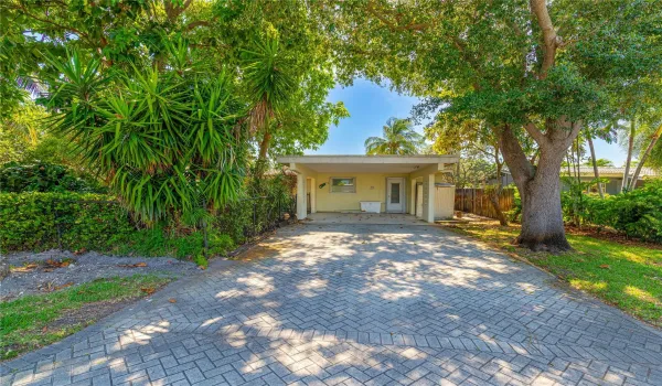 Carport for two vehicles and additional driveway parking.