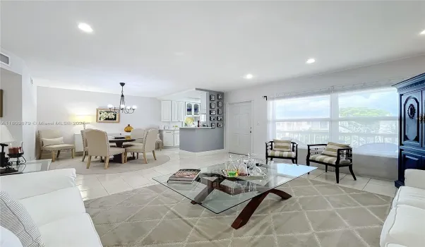 Enter into a luxurious living room area with hat lighting and room to entertain and socialize.
