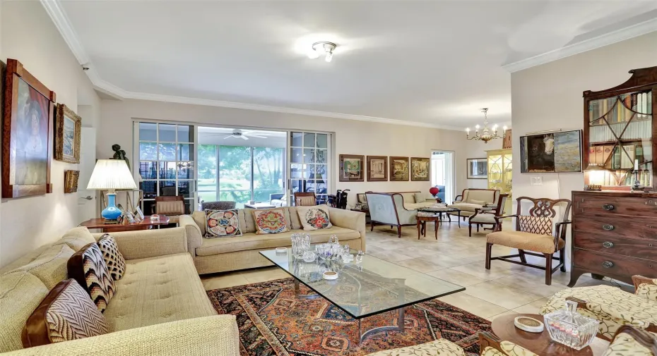 Living room with den on right and media room in back