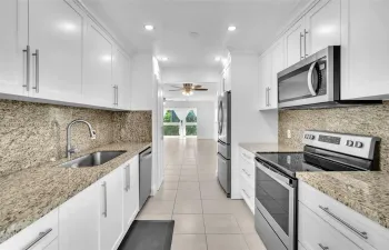 Kitchen - Notice Granite Counters & Back Splash