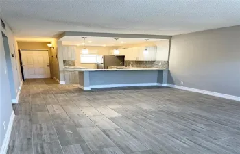 Renovated kitchen with view of living and dining