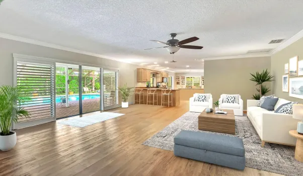 Sprawl out with family and friends in your HUGE family room with crown molding and 4 HURRICANE RATED sliders to the large, covered patio.