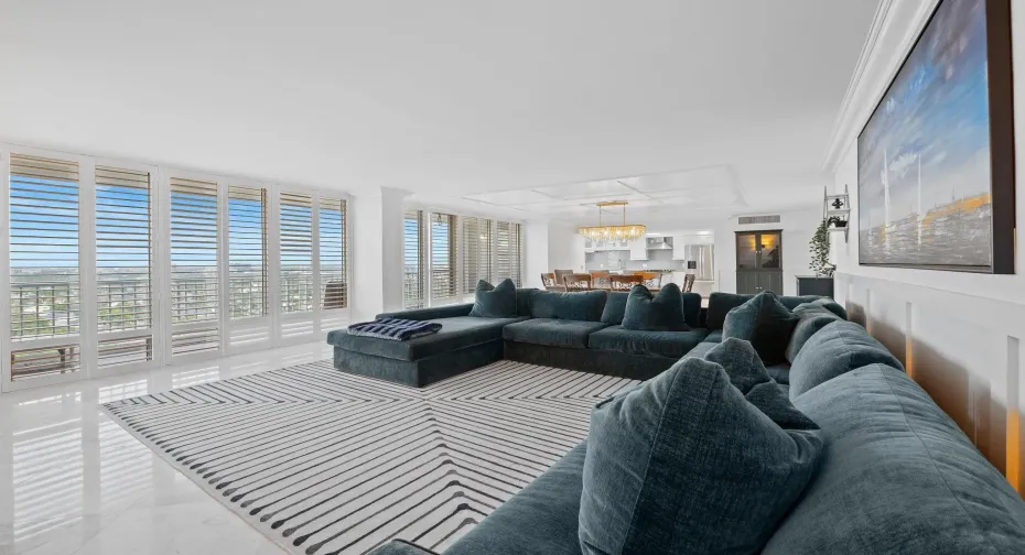 Huge living and dining area with floor to ceiling glass