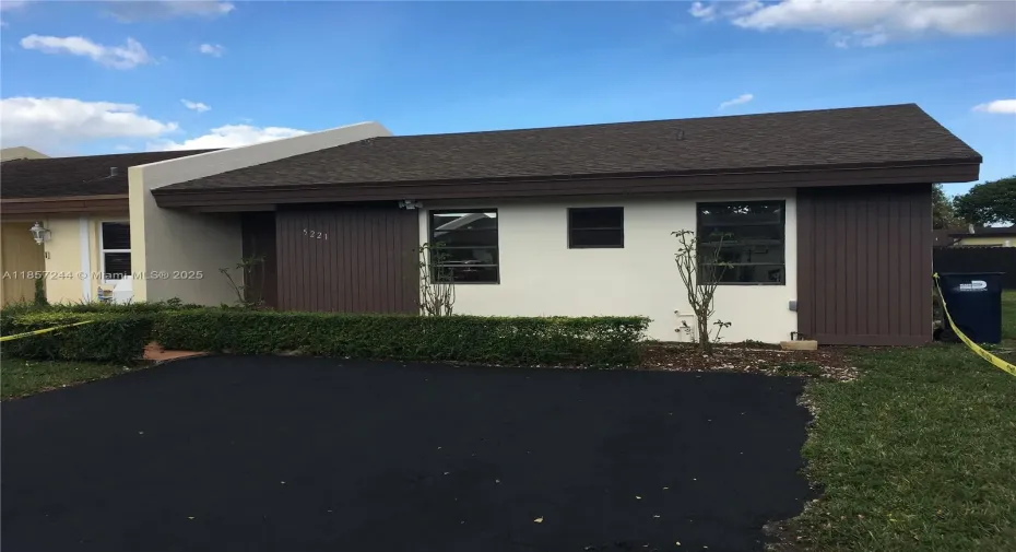 Front view, freshly painted exterior and driveway.
