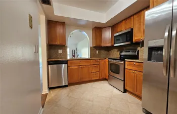 Kitchen with pass-through to dining area