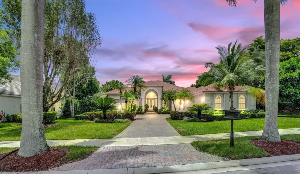 Grand entry upon arrival! One of a kind driveway in the neighborhood, surrounded with manicured landscaping, and with extra-long expansive drive to front car courtyard, with large side-entry 3CG.