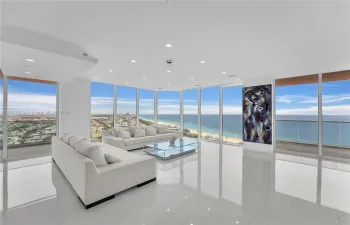 Large Grand Living Room w 90 degree views and two balconies-North & East.  No fixed columns in interior. Motorized shades on every window.