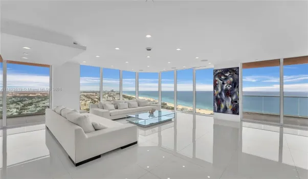 Large Grand Living Room w 90 degree views and two balconies-North & East.  No fixed columns in interior. Motorized shades on every window.