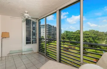 Glass Enclosed Balcony 
w/water & greenery view