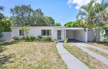 Front of house with covered carport