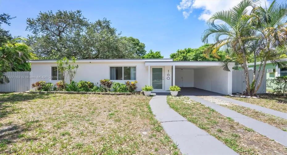 Front of house with covered carport