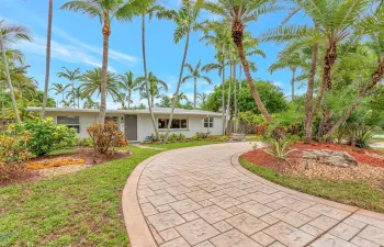 Lovely curb appeal. Extended paver driveway