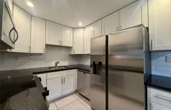 Updated Kitchen with Shaker Cabinets and Stainless Steel Appliances