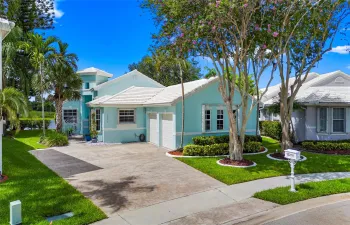 Step into serenity with this beautifully maintained Key West-style home tucked inside the gated Grand Palms community in the Wilshire subdivision.