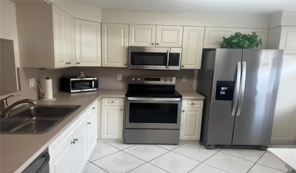 ALL WHITE CABINETS AND STAINLESS STEEL APPLIANCES