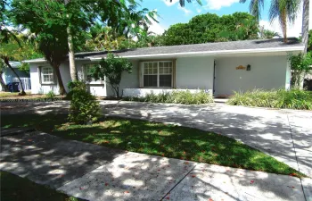 Shady tree gives the front of the home privacy and charm.