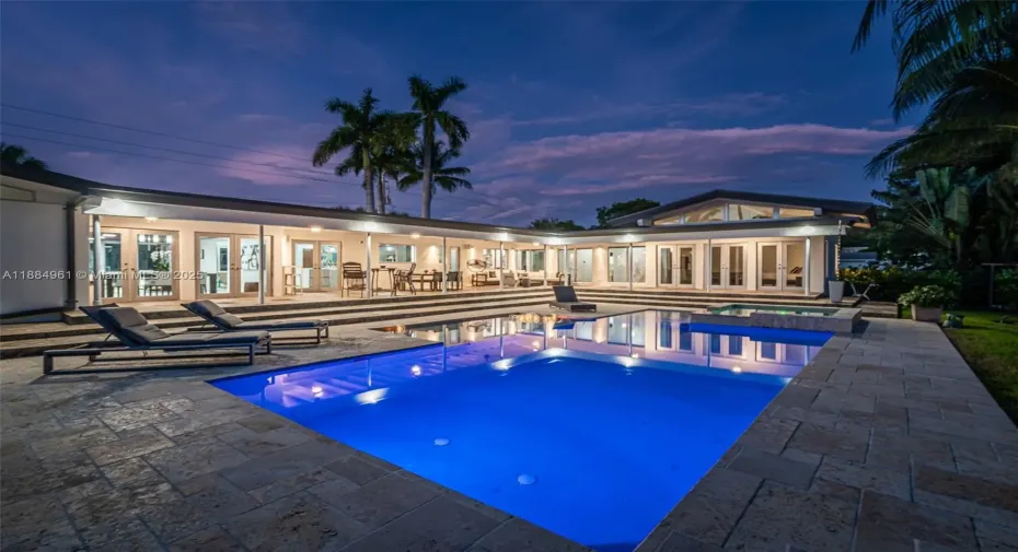 Impressive L-shaped terrace surrounds the resort-style heated pool and spa