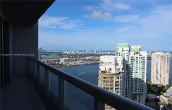 Enjoy sweeping views from the main balcony overlooking Brickell Key, the Port of Miami, South Beach, and the historic Miami River — an ideal setting for relaxing or entertaining high above the city.