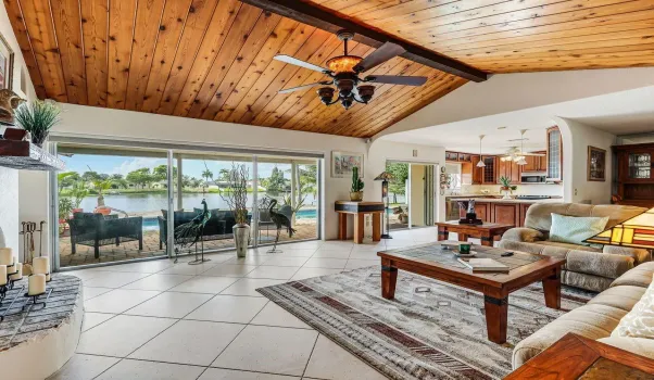 Living room open concept cathedral ceilings lake view