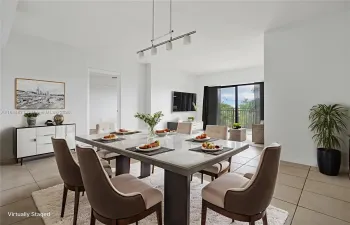 Spacious dinning area overlooking the living room and balcony