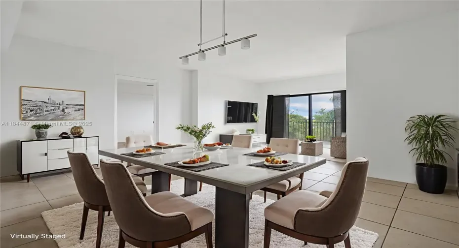 Spacious dinning area overlooking the living room and balcony
