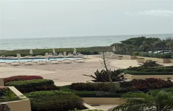 View from your private balcony over the courtyard, pool to the ocean
