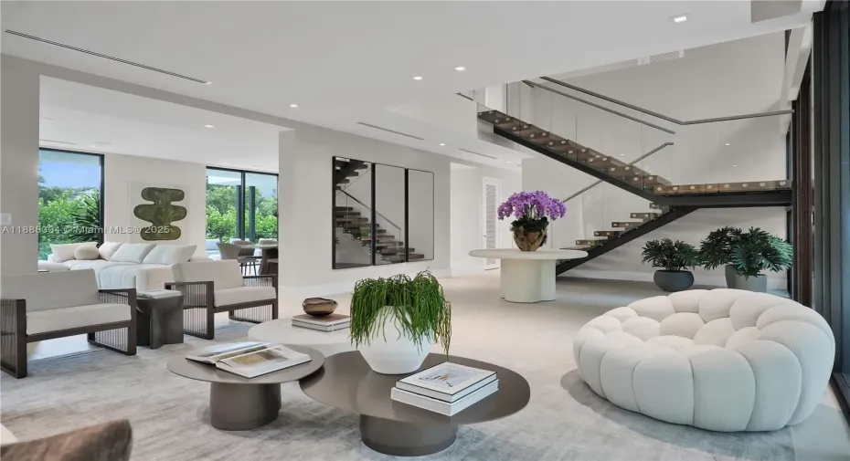 Spacious Entrance and Living Room Area with Volume Ceiling