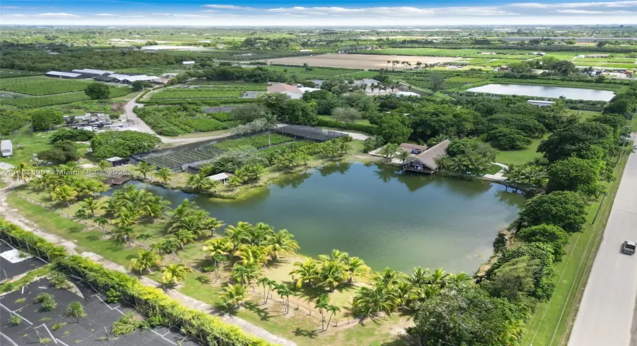  PRIVACY IS WHAT THIS IS ALL ABOUT.......APPROX 5 ACRES INCLUDES MULTIPLE OUTBUILDINGS .. DINING, MULTIUSE AND STUDIOS.  8 DOORS... PLUS EXTERIOR TIKIS WATERFALLS PARKING LOTS. LUSH GROUNDS..NURSERY NOT INCLUDED