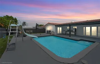 Crystal-clear swimming pool for refreshing dips or hosting poolside gatherings.