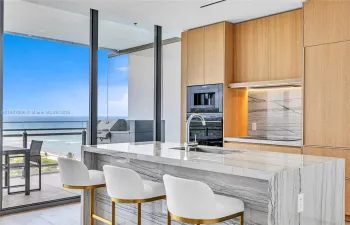 Enjoy beautiful ocean views as you enter your spacious open-plan condo with floor-to-ceiling glass-wall and 10ft ceilings.