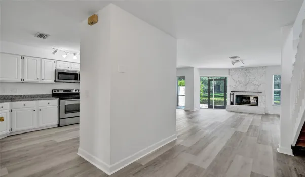 Entrance to unit with kitchen adjacent left