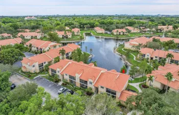 Completely Remodeled Waterfront Corner Unit with Screened Balcony & IN UNIT LAUNDRY ROOM with FULL SIZED WASHER & DRYER. Royal Poinciana features - Gated Entry, Resort Style Pool, PET FRIENDLY with Pet Park, GYM OPEN 24 HOURS, Clubhouse, On-Site Car Care Center, Tennis, Racquetball & a 1 Mile Long Lakeside Sidewalk Path! WELCOME HOME!