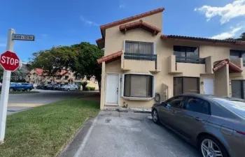 front of corner townhouse and two parking spaces next to unit- lots of guest parking