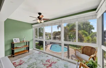 Impact Glass Patio overlooks the pool and the waterway