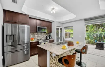 Move right in and enjoy the UPDATED features of this SENSATIONAL 3/2.5 TH in Cocoplum.