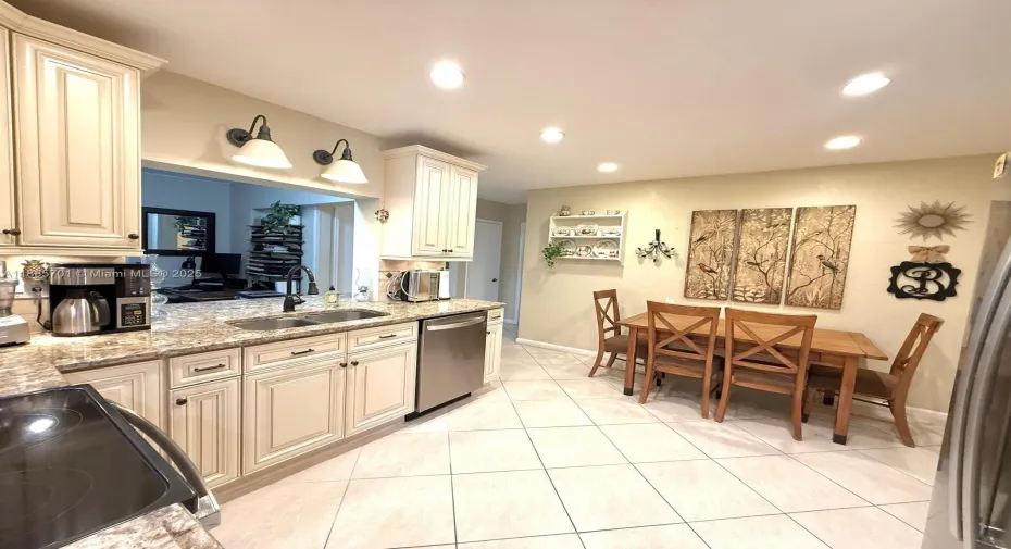 Spacious kitchen with 4 piece stainless steel appliances. Eat-in breakfast area fits large table with seating for 6 people. Also includes 3 pantries. Can be closed off to Dining/ Entry areas for cooks that like to hide their mess during parties/ holidays, etc