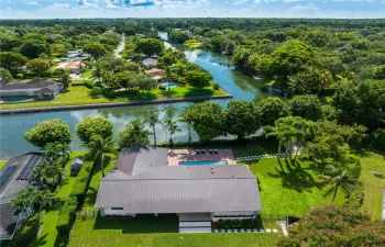 Unique opportunity in Pinecrest! Fully remodeled home on 21,000 sq.ft. lot with rare double-canal views, new finishes, and spacious layout.