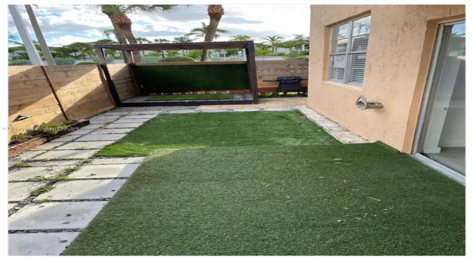 SIDE PATIO COMPLETELY FENCED WITH DOOR FOR OUTSIDE ACCESS
