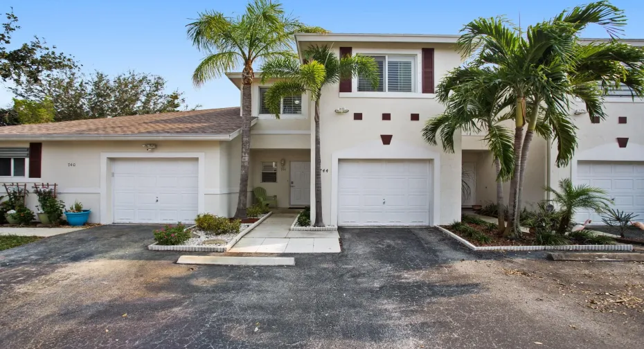 Front view of the townhouse with an attached garage.
