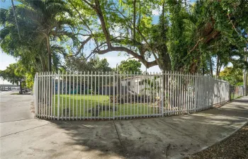 Corner lot which is being sold along with the building next door.