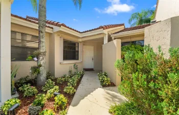This corner villa offers 3 bedrooms, 2 bathrooms, and a spacious layout that includes a large primary suite with a walk-in closet and private bathroom.