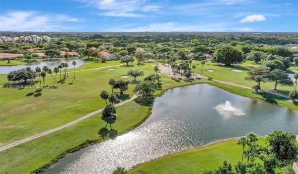 Enjoy serene golf course living with wide fairways, water features, and palm-dotted greens. Peaceful walking paths and gorgeous lake views create the perfect backdrop for everyday relaxation.