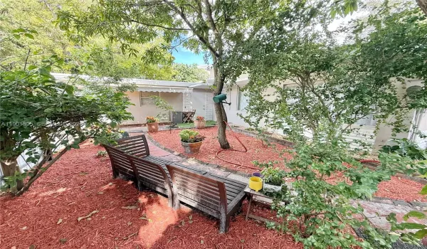 Entrance to front of property, fully fenced in yard with 4 parking spots in front and a huge gate to pull in an RV or a boat, etc.