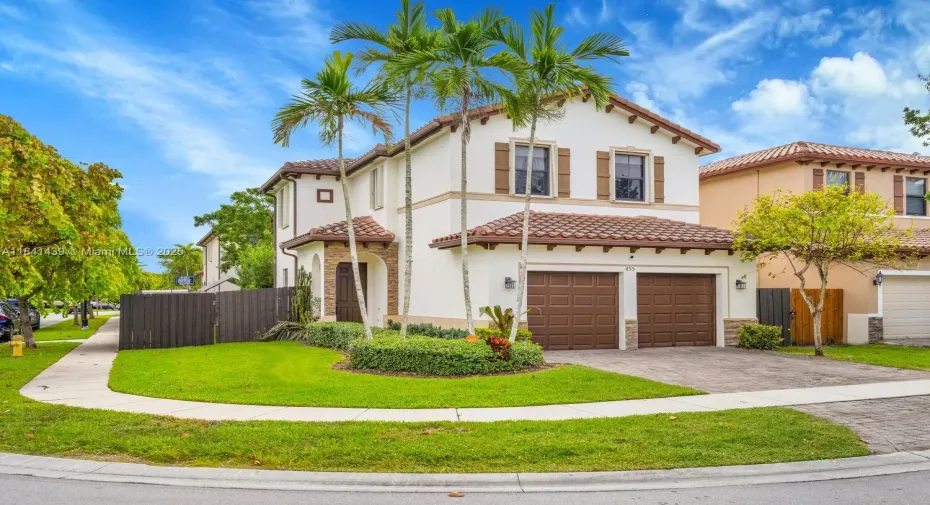 Spacious corner 2-story Mediterranean gem with a 2-car garage and a huge fenced backyard!